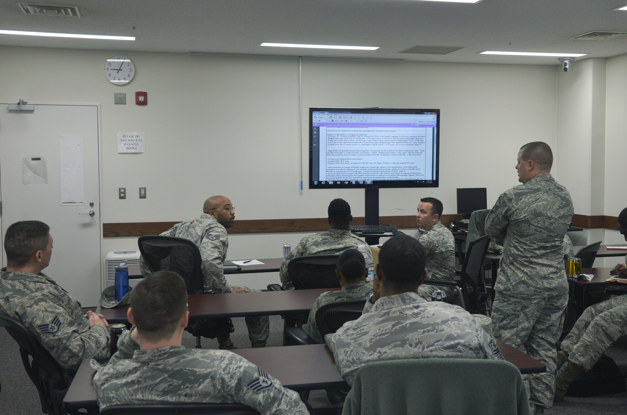 Members of an effective writing course discuss how to best write a bullet at Yokota Air Base, Japan, Jan. 27, 2017. The course provided members with a different outlook from members across the base to enhance their abilities to effectively tell their subordinates story to various career fields. (U.S. Air Force photo by Staff Sgt. David Owsianka)