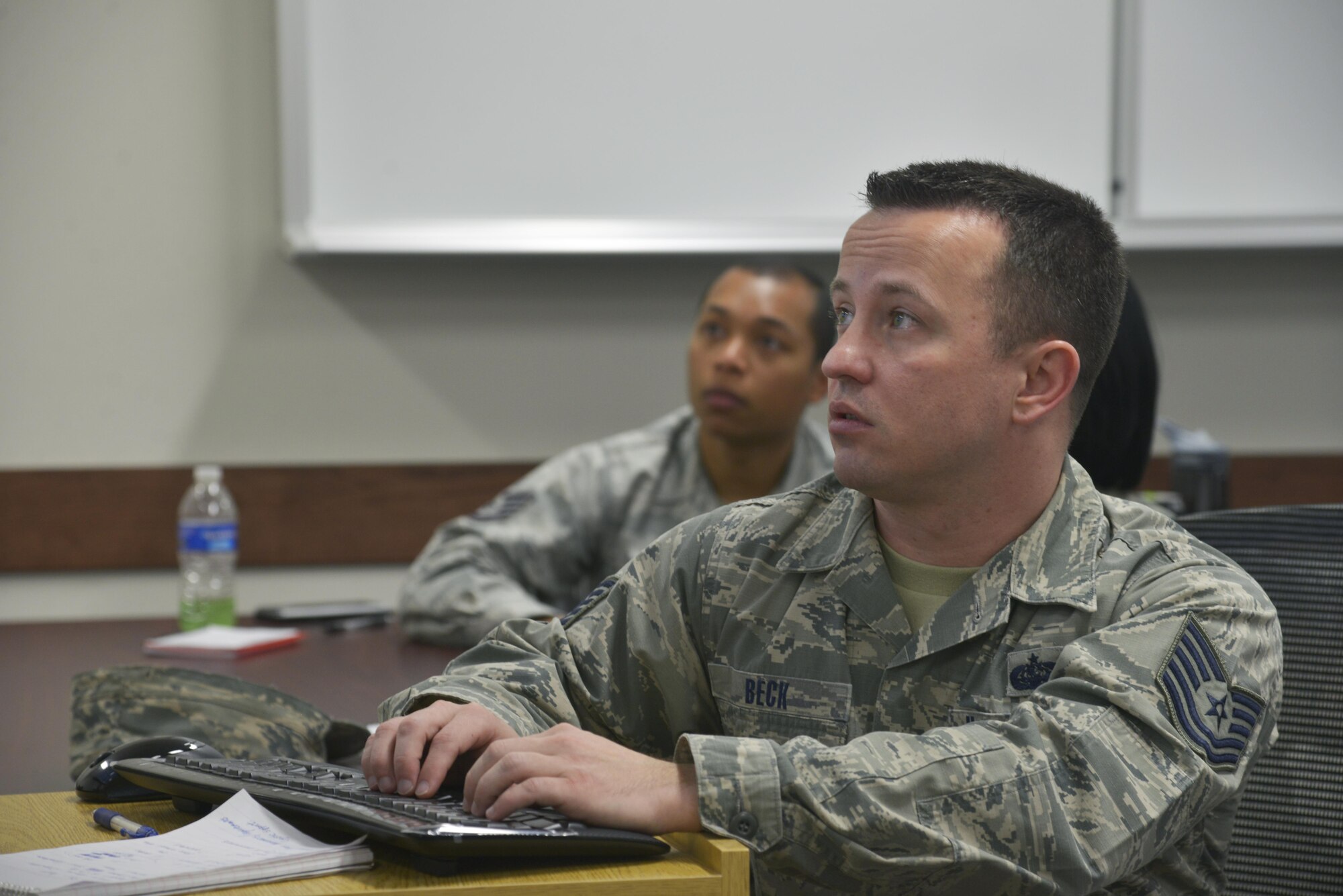 Tech. Sgt. Jacob Beck, American Forces Network pacific regional maintenance technician, writes a bullet during an effective writing course at Yokota Air Base, Japan, Jan. 27, 2017. The course provided 30 minutes of power point slides to inform the class attendees what is to be expected from the course, and then moved into an interactive learning style between the teachers and students. (U.S. Air Force photo by Staff Sgt. David Owsianka)