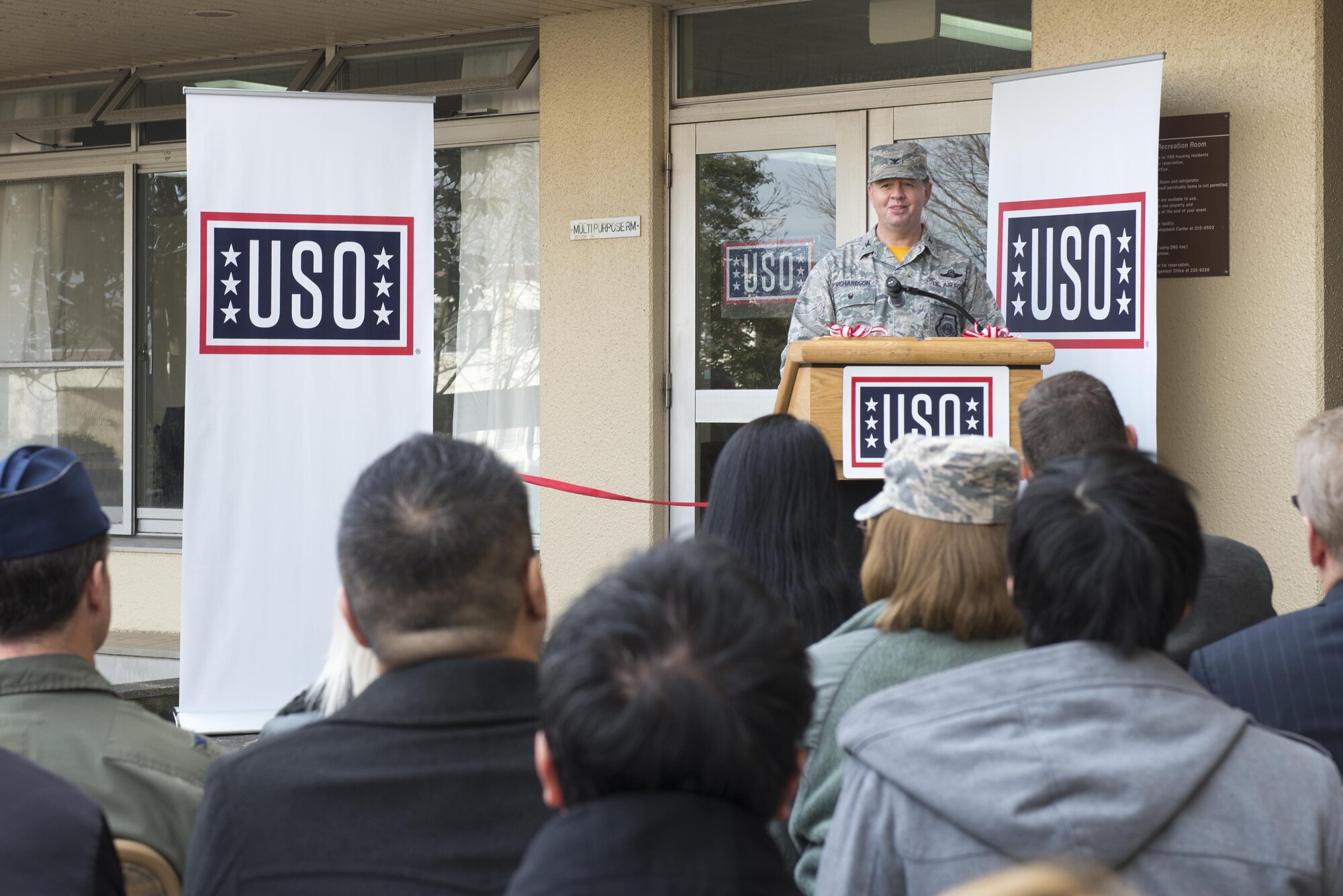 Col. Neil Richardson, 374th Airlift Wing vice commander, gives a speech during the United Service Organizations center grand opening at Yokota Air Base, Japan, Jan. 27, 2017. Richardson thanked all of the USO volunteers and the USO sponsors for supporting the Yokota community. (U.S. Air Force photo by Senior Airman David C. Danford)