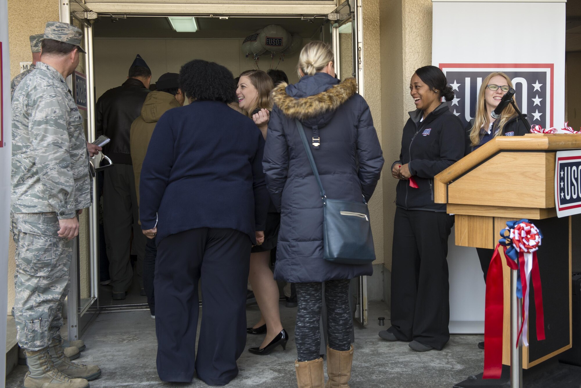 Guests attend the United Service Organizations center grand opening at Yokota Air Base, Japan, Jan. 27, 2017. The center will be moving from its current temporary location to the Yujo Community Center later in the year once renovations are complete. (U.S. Air Force photo by Senior Airman David C. Danford)
