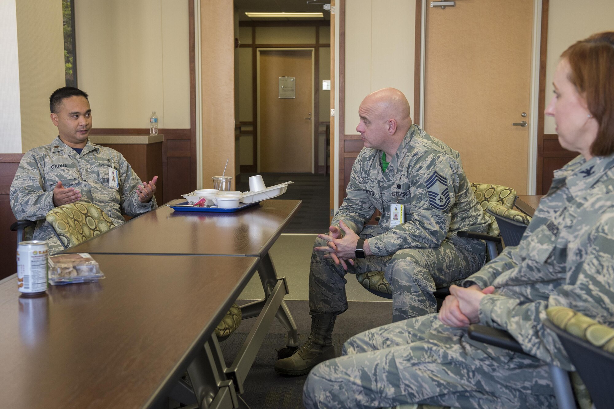 (Left) Maj. Edgar Cadua, 374th Aerospace Medicine Squadron bioenvironmental engineering flight commander, asks a question during a luncheon learn event held as part of the Biomedical Sciences Corps appreciation week at Yokota Air Base, Japan, Jan. 27, 2017. The BSC is made up of 17 career specialties who work together to provide a broad base of clinical and scientific expertise for the Air Force Medical Service. (U.S. Air Force photo by Senior Airman David C. Danford)