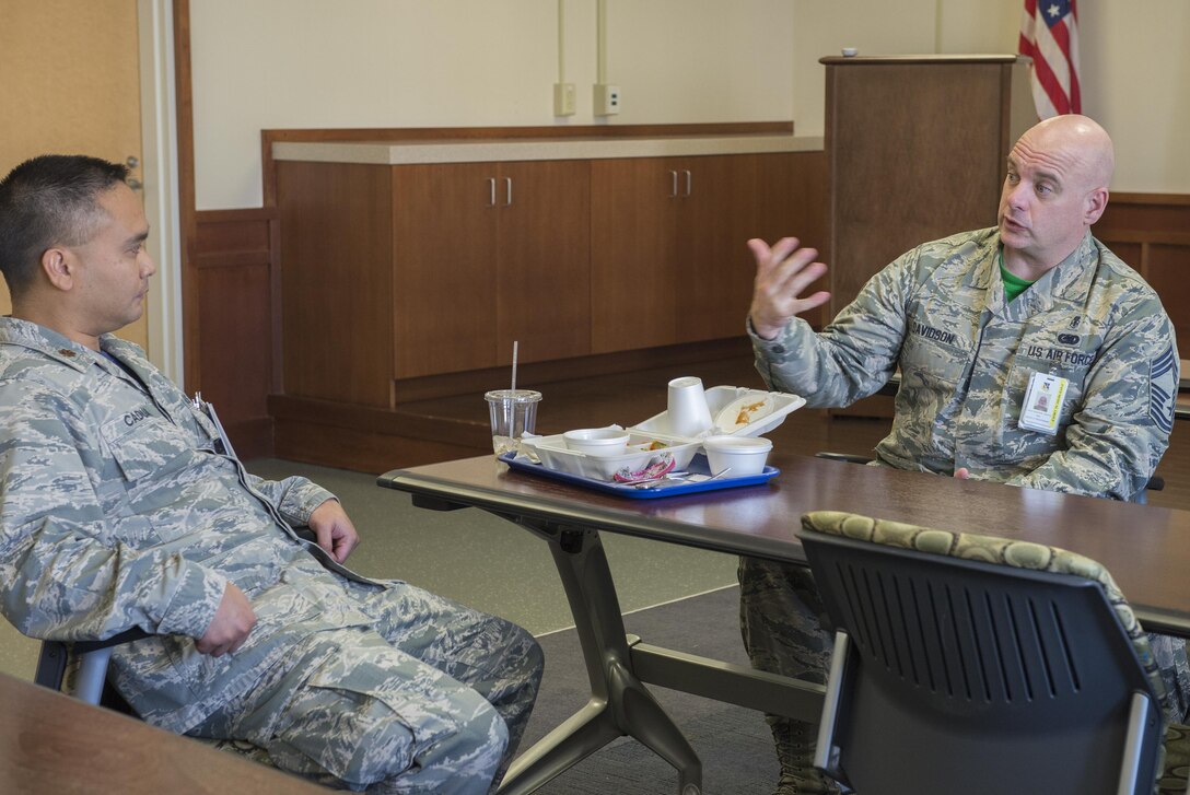 (Right) Chief Master Sgt. Timothy Davidson, 374th Medical Group command chief, provides mentorship during a luncheon learn event held as part of the Biomedical Sciences Corps appreciation week at Yokota Air Base, Japan, Jan. 27, 2017. The BSC is made up of 17 career specialties who work together to provide a broad base of clinical and scientific expertise for the Air Force Medical Service. (U.S. Air Force photo by Senior Airman David C. Danford)