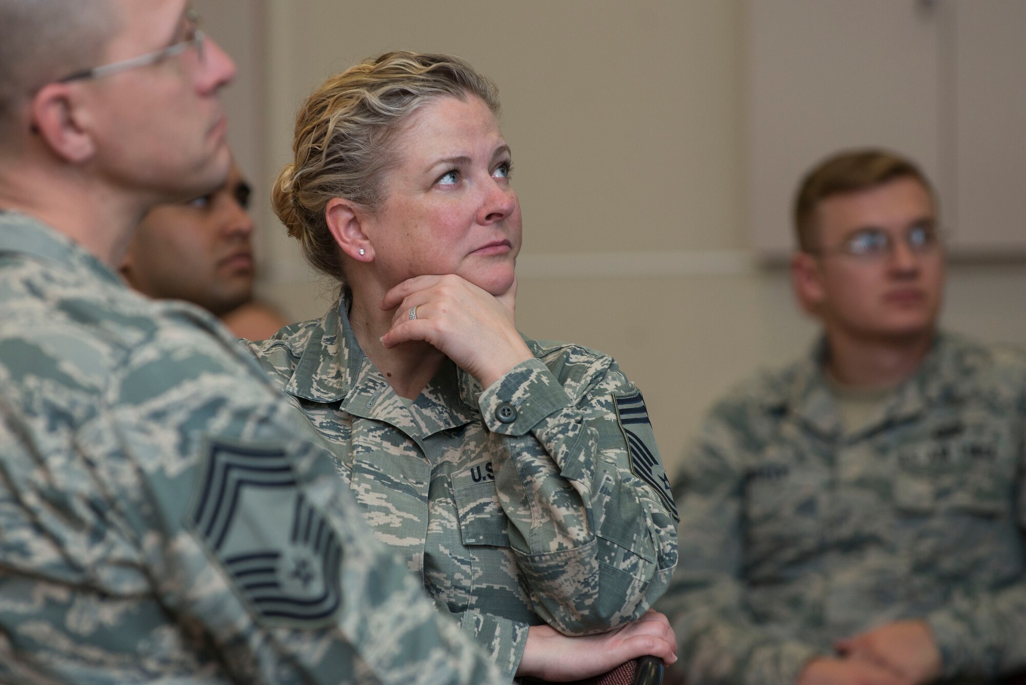 Chief Master Sgt. Stephanie Cates, 447th Air Expeditionary Group superintendent, listens as Chaplain (Maj. Gen.) Dondi Costin, Air Force chief of chaplains, speaks during a spiritual fitness luncheon, Jan. 26, 2017, at Incirlik Air Base, Turkey. More than 100 Airmen gathered at the community center for the event. (U.S. Air Force photo by Senior Airman John Nieves Camacho)