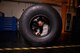 U.S. Air Force Senior Airman Tyler Hyatt, 100th Maintenance Squadron aero repair journeyman, removes a phenolic ring from a tire after separating the wheel and tire assembly Jan. 20, 2017, on RAF Mildenhall, England. The ring helps stop the two pieces from grinding metal on metal. (U.S. Air Force photo by Senior Airman Christine Halan)