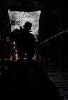 Staff Sgt. Zachary Rodewig, 721st Aircraft Maintenance Squadron C-5 Galaxy crew chief, descends a ladder from the flight deck of C-5 at Ramstein Air Base, Germany, Jan. 24, 2017. Rodewig chocked the wheels, checked the tire pressure, and refueled the aircraft. On average, the 721st AMXS inspects, services, and repairs 30 aircraft in a single day, as part of the 521st Air Mobility Operations Wing at Ramstein. (U.S. Air Force photo by Senior Airman Tryphena Mayhugh)