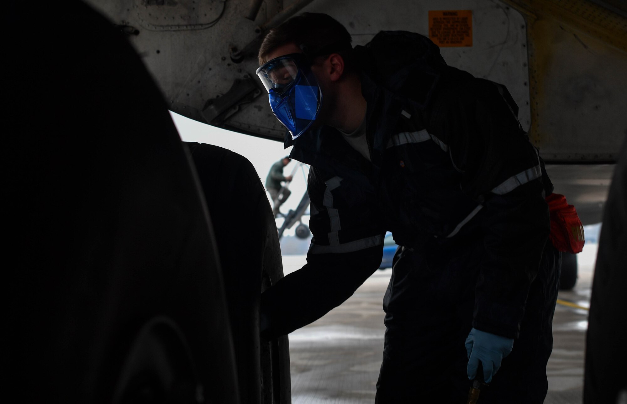 Staff Sgt. Zachary Rodewig, 721st Aircraft Maintenance Squadron C-5 Galaxy crew chief, removes the cap on a tire of a C-5 at Ramstein Air Base, Germany, Jan. 4, 2017. Rodewig checked the tire pressure of all 28 tires on the plane. The 721st AMXS inspects, repairs, and services all C-17 and C-5 Galaxy aircraft that come through Ramstein. (U.S. Air Force photo by Senior Airman Tryphena Mayhugh)