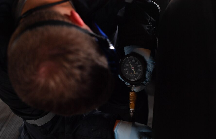 Staff Sgt. Zachary Rodewig, 721st Aircraft Maintenance Squadron C-5 crew chief, checks the tire pressure on a C-5M Super Galaxy aircraft at Ramstein Air Base, Germany, Jan. 24, 2016. Rodewig and other 721st AMXS Airmen also refilled the oil and refueled the plane. The 721st AMXS inspects, repairs, and services all C-17 and C-5 Galaxy aircraft that come through Ramstein. (U.S. Air Force photo by Senior Airman Tryphena Mayhugh)