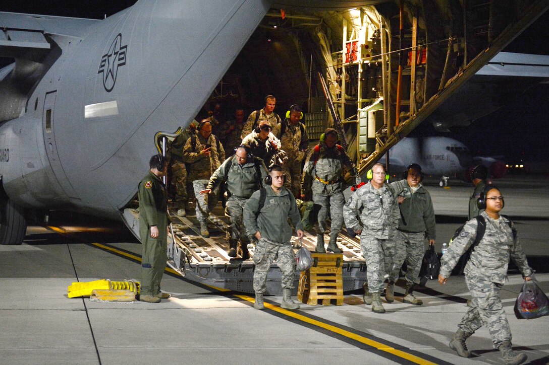 National Guardsmen disembark from a C-130 Hercules aircraft before participating in Red Flag 17-1 at Nellis Air Force Base, Nev., Jan. 19, 2017. The airmen are assigned to the Florida Air National Guard’s 125th Fighter Wing. Air National Guard photo by Master Sgt. William J. Buchanan