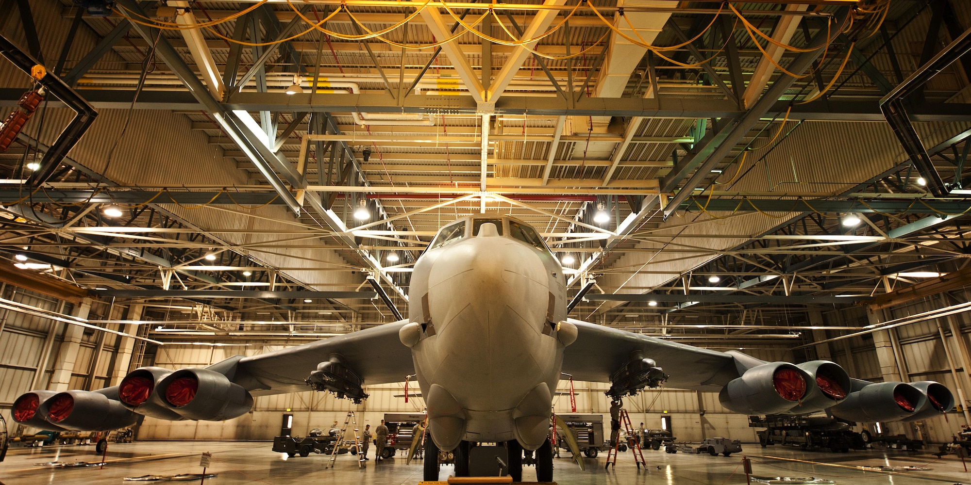 Weapons load crew members prepare for the Load Crew of the Quarter competition inside Dock 7, at Minot Air Force Base, N.D., Jan. 20, 2017. Two weapons load crews, representing the 23rd Aircraft Maintenance Unit and the 69th AMU, were timed on their ability to load two inert munitions onto a B-52H Stratofortress. (U.S. Air Force photo/Airman 1st Class J.T. Armstrong)