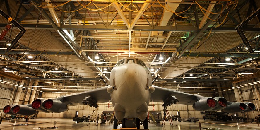 Weapons load crew members prepare for the Load Crew of the Quarter competition inside Dock 7, at Minot Air Force Base, N.D., Jan. 20, 2017. Two weapons load crews, representing the 23rd Aircraft Maintenance Unit and the 69th AMU, were timed on their ability to load two inert munitions onto a B-52H Stratofortress. (U.S. Air Force photo/Airman 1st Class J.T. Armstrong)