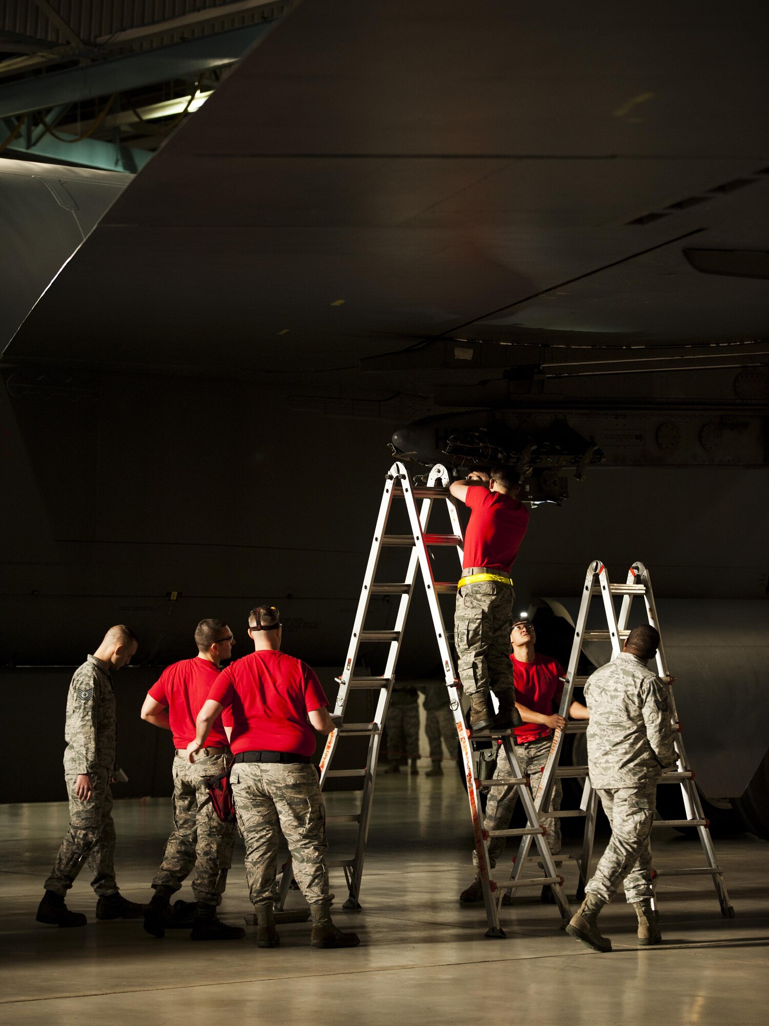 Weapons load crew members representing the 23rd Aircraft Maintenance Unit participate in the Load Crew of the Quarter competition at Minot Air Force Base, N.D., Jan. 20, 2017. The 23rd triumphed over the 69th AMU in this quarter’s load crew completion. (U.S. Air Force photo/Airman 1st Class J.T. Armstrong)