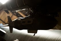 An inert GBU-31 munition hangs from the bomb rack of a B-52H Stratofortress after the Load Crew of the Quarter competition at Minot Air Force Base, N.D., Jan. 20, 2017. The competition was comprised of four parts: dress and appearance, a loader’s knowledge test, toolbox inspection and the timed bomb load. (U.S. Air Force photo/Airman 1st Class J.T. Armstrong)