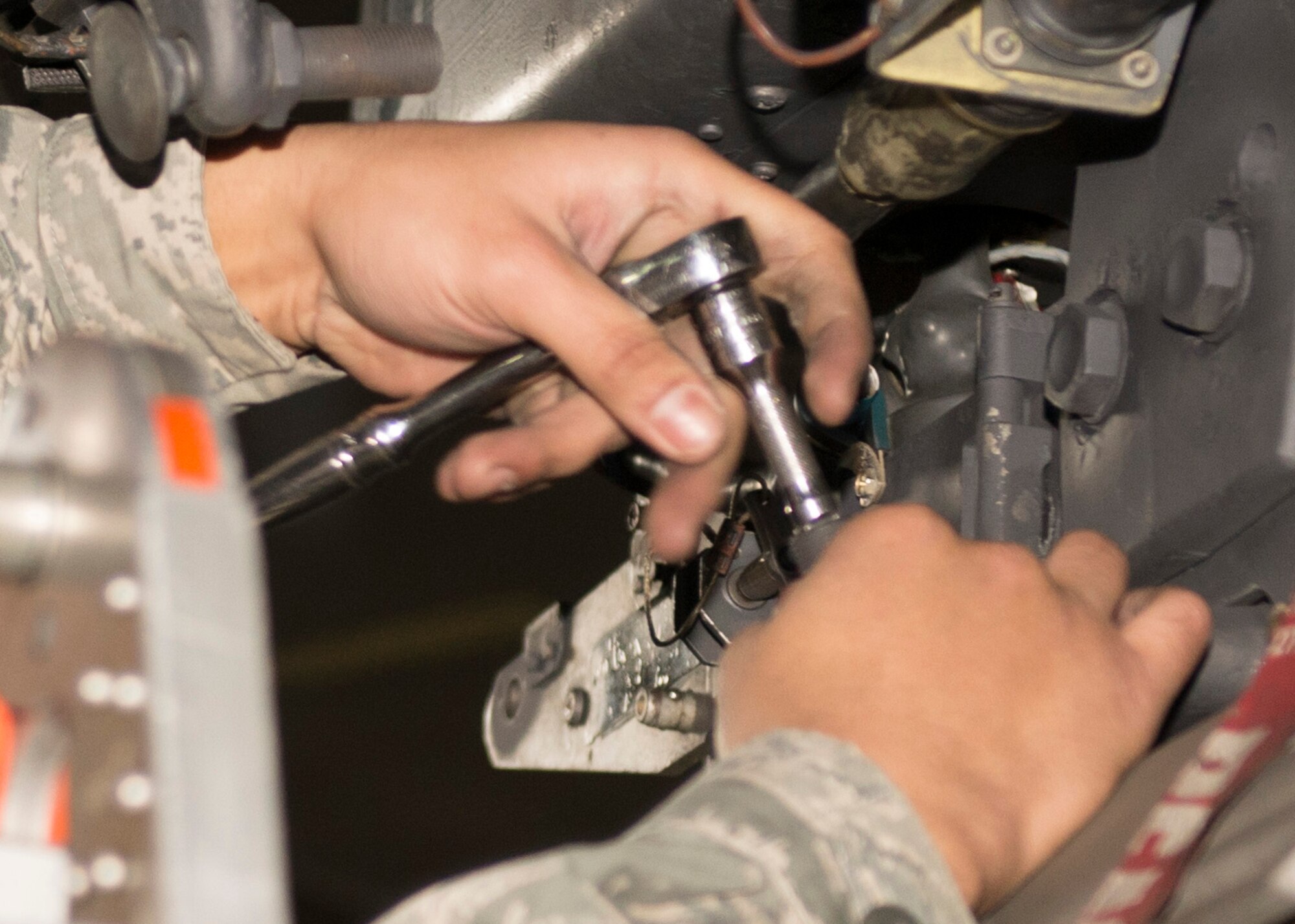 Senior Airman Philip Johnson, 69th Aircraft Maintenance Unit weapons load crew member, works on a B-52H Stratofortress during the 5th Bomb Wing Load Crew of the Quarter competition in Dock 7 at Minot Air Force Base, N.D., Jan. 20, 2017. The 23rd and 69th AMU competed in a timed bomb load as a part of the Load Crew of the Quarter competition. (U.S. Air Force photo/Airman 1st Class Alyssa M. Akers)