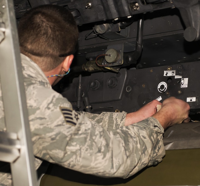 Staff Sgt. Eric Hathaway, 69th Aircraft Maintenance Unit weapons load crew chief, works on a B-52H Stratofortress during the 5th Bomb Wing Load Crew of the Quarter competition in Dock 7 at Minot Air Force Base, N.D., Jan. 20, 2017. The competition was comprised of four parts: dress and appearance, a loader’s knowledge test, toolbox inspection and the timed bomb load. (U.S. Air Force photo/Airman 1st Class Alyssa M. Akers)