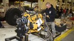 Dustin Wiley, a wheeled mechanic at Production Plant Barstow, Marine Depot Maintenance Command, works on the engine that powers the Mine Resistant Ambush Protected All Terrain Vehicles, or M-ATV, currently being repaired and upgraded at the Plant Jan. 12, 2017. Wiley is a former Army National Guardsman who served in Afghanistan as a mechanic. He said he has driven and worked on the M-ATVs and knows the heavily built troops transports save lives.