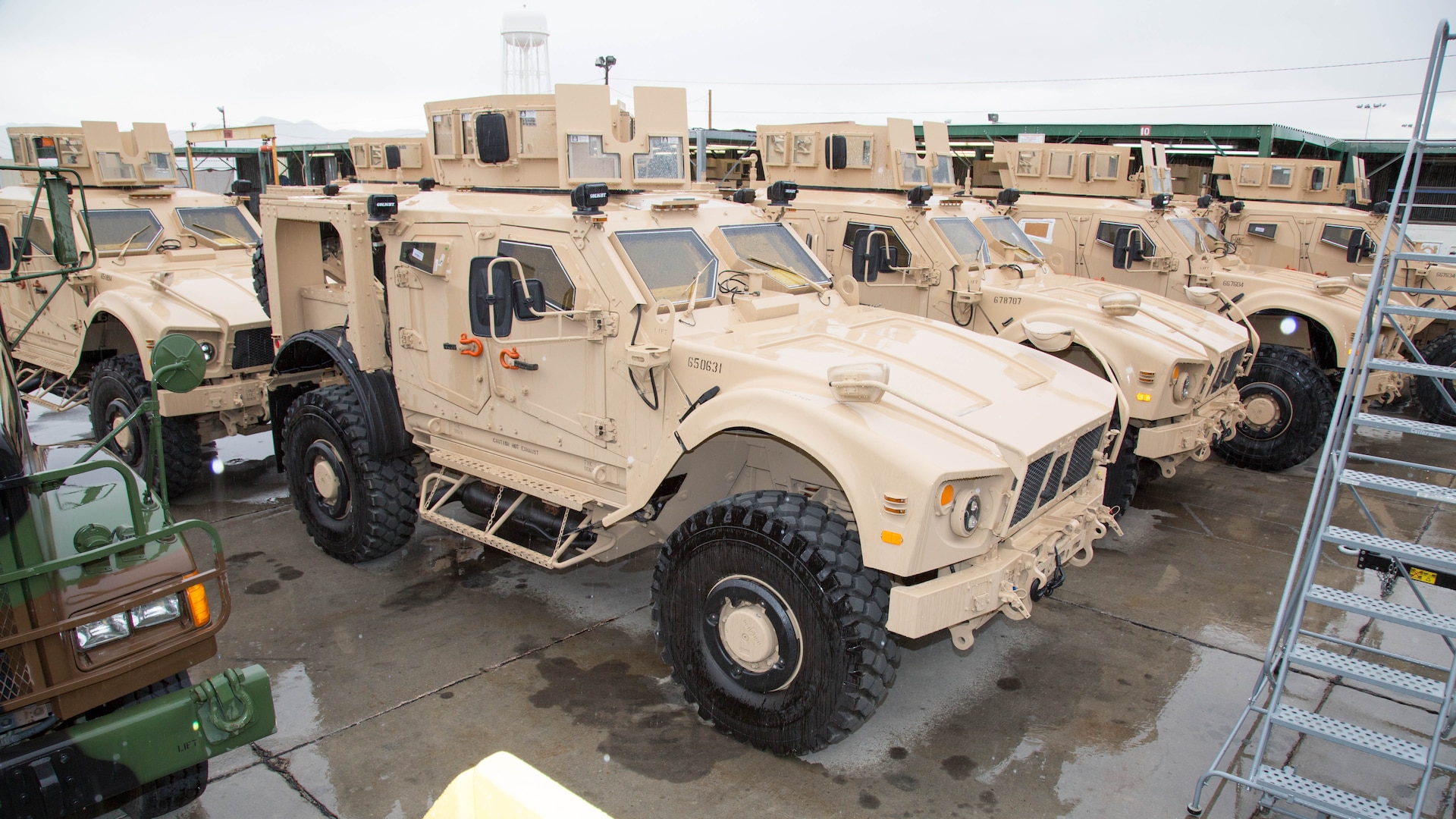 Mine Resistant Ambush Protected All Terrain Vehicles have finished their upgrades, armor improvements and await road testing at Production Plant Barstow, Marine Depot Maintenance Command, on the Yermo Annex of Marine Corps Logistics Base Barstow, California, Jan. 12, 2017. The specialized vehicles are favored for troop transporting in the mountainous country of Afghanistan. The turret atop the M-ATV marks this as a Marine Corps variant of the MRAP.
