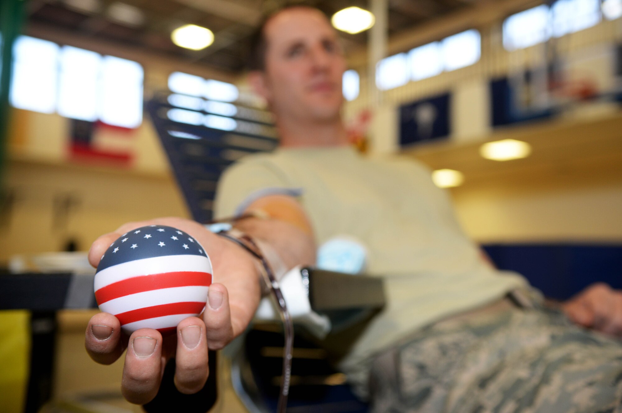 A Team Mildenhall Airman donates blood at a blood drive May 4, 2016, on RAF Mildenhall, England. The blood drive was held by the Armed Services Blood Program. (U.S. Air Force photo by Airman 1st Class Tenley Long)
