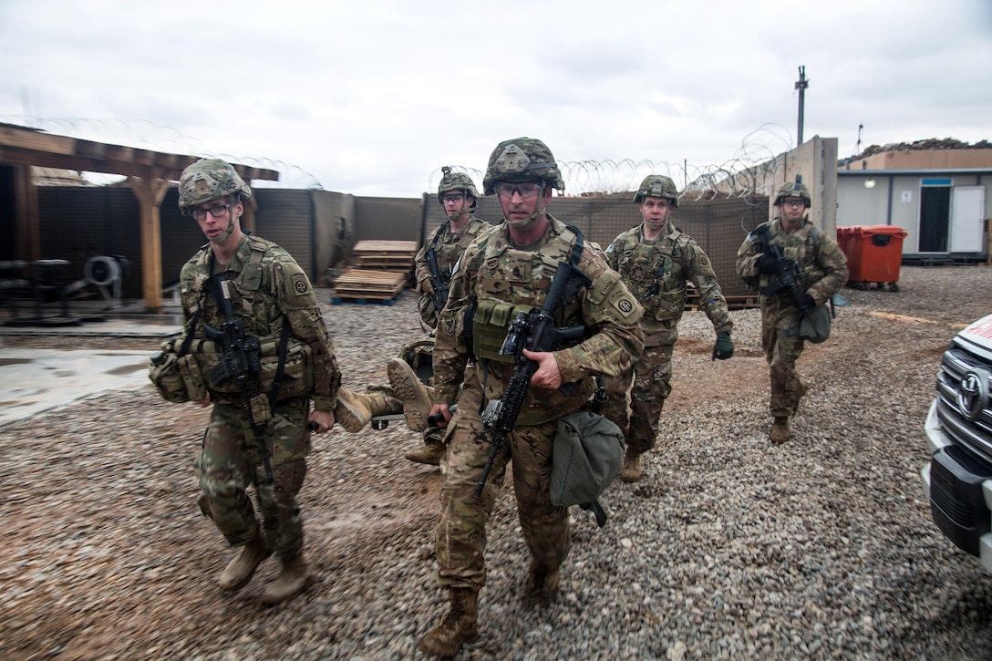 Army paratroopers evacuate a simulated casualty during medical training at Camp Swift in Makhmour, Iraq, Jan. 22, 2017. Army photo by Spc. Ian Ryan