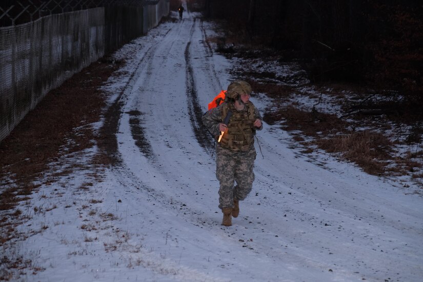 KAISERSLAUTERN, Germany — Sgt. Erin Hodge, from the office of the surgeon, 7th Mission Support Command, hurries during the 7th MSC noncommissioned officer Best Warrior Competition ruck march, Jan. 24, 2017.