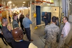 Kim Baird, DLA Distribution Hill, Utah shelter maintenance supervisor, describes a new support structure used for maintaining missile launch facilities and control centers to customers Jan. 25, 2017, at Hill Air Force Base, Utah. (U.S. Air Force photo by Todd Cromar)
