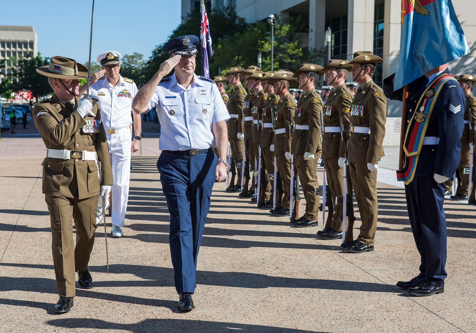 U.S. Air Force Gen. John E. Hyten (center), commander of U.S. Strategic Command (USSTRATCOM), returns a salute to Australian Defence forces (ADF) with Royal Australian Navy Vice Adm. Ray Griggs (background, center left), vice chief of the ADF at Russell Offices, Canberra, Jan. 17, 2017. The ADF honor guard was present for the formal arrival during the USSTRATCOM-Australia Defence Organization bi-lateral engagement. The visit aligns with USSTRATCOM’s priority to enhance interoperability between U.S. and Australian forces; expand cooperation in space, cyberspace, intelligence and missile defense; and identify future opportunities for cooperation and engagement. One of nine DoD unified combatant commands, USSTRATCOM has global strategic missions assigned through the Unified Command Plan that include strategic deterrence; space operations; cyberspace operations; joint electronic warfare; global strike; missile defense; intelligence, surveillance and reconnaissance; and analysis and targeting. 