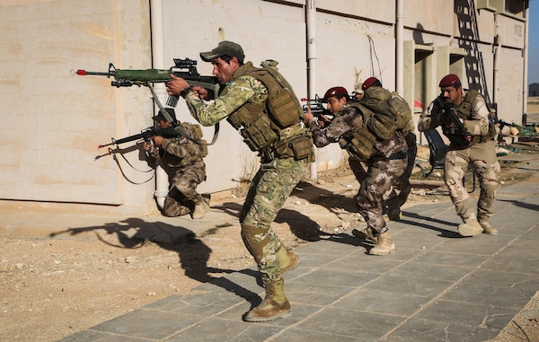 Iraqi soldiers from 7th Iraqi Army Division maneuver as a squad during the platoon assault movement portion of their culminating training at Al Asad Air Base, Iraq, Jan. 15, 2017. Training at building partner capacity sites is an integral part of Combined Joint Task Force – Operation Inherent Resolve’s effort to train Iraqi security forces personnel. CJTF-OIR is the global Coalition to defeat ISIL in Iraq and Syria. (U.S. Army photo by Sgt. Lisa Soy)