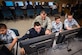 Maj. Trevor Cook, ICBM Systems Directorate Cyber Division deputy chief, mentors cadets at the Utah Military Academy, Riverdale, Utah, Jan. 5. The cadets – from the left: Cadet Airman Basic James Gill, Cadet Airman 1st Class Donaven Ellis, Cadet Airman Basic Jacob Hite and Cadet Airman Basic Caleb Gerhardt – are participating in Cyber Patriot IX, an annual competition for middle- and high-school students designed to prepare them for careers in cybersecurity and STEM (science, technology, engineering, and mathematics) disciplines. (U.S. Air Force photo by Paul Holcomb)