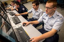 Cadet Airman Basic Caleb Gerhardt, Cadet Airman Basic Jacob Hite, Cadet Airman 1st Class Donaven Ellis and Cadet Staff Sgt. Zack Mickelsen, all students at the Utah Military Aademy in Riverdale, Utah, participate in CyberPatriot IX, Jan. 5. (U.S. Air Force photo by Paul Holcomb)