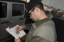Senior Airman Gary Terrio, a 5th Security Forces Squadron installation entry controller, checks an I.D. card at Minot Air Force Base, N.D., Jan. 19, 2017. All security forces Airmen must first pass a test to be allowed to check the I.D.s of base visitors. (U.S. Air Force photo/Airman 1st Class Alyssa M. Akers)