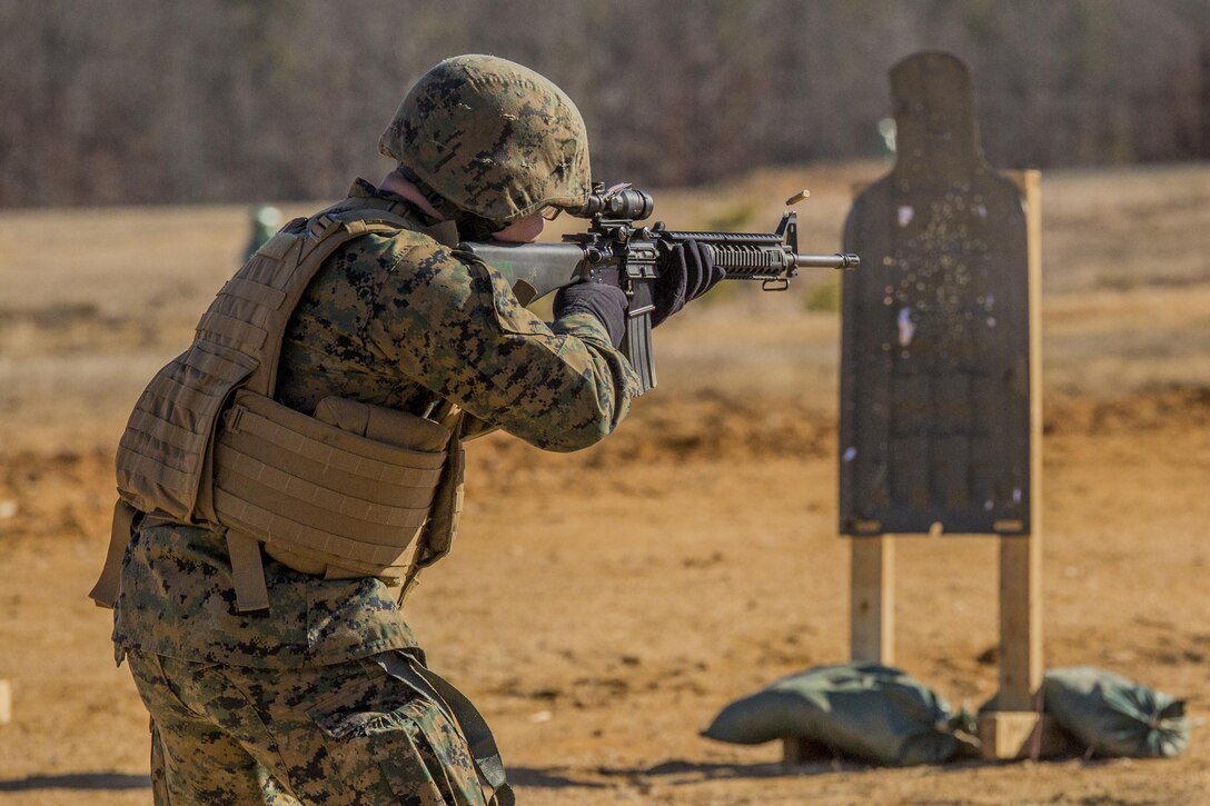 U.S. Marine Corps Lance Cpl. Samuel Minear, Headquarters and Service Company, Marine Barracks Washington, D.C., fires an M16A4 service rifle during a Combat Marksmanship Program range at Marine Corps Base Quantico, Va., Jan. 26, 2017. Marines with H&S Co.  execute training  evolutions to simulate close-range, fire and maneuver combat operations. (Official Marine Corps photo by Lance Cpl. Damon A. Mclean/Released)