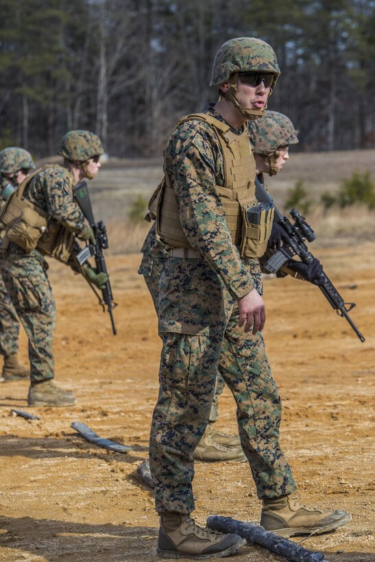 U.S. Marine Corps Cpl. Tanner Marshall, Headquarters and Service Company, Marine Barracks Washington, D.C., reiterates commands to Marines on the firing line during a Combat Marksmanship Program range at Marine Corps Base Quantico, Va., Jan. 26, 2017. Marines with H&S Co. execute training evolutions to simulate close-range, fire and maneuver combat operations. (Official Marine Corps photo by Lance Cpl. Damon A. Mclean/Released)
