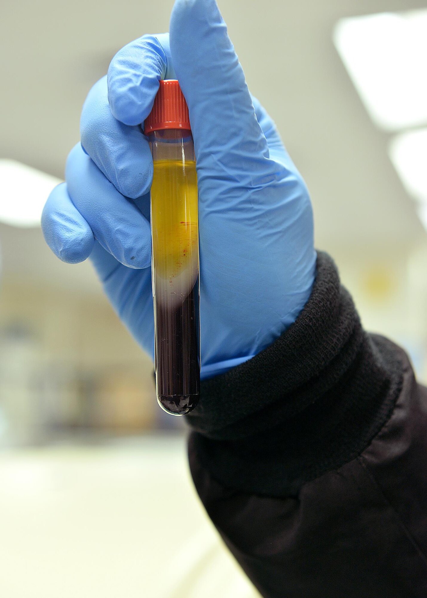 U.S. Air Force Staff Sgt. Christopher Fultz, with the 55th Medical Group, holds a tube with separated plasma and blood inside the Ehrling Bergquist Clinic on Offutt AFB, Neb., Jan. 26. Members of the Air Force’s Biomedical Sciences Corps were recognized during an appreciation week held January 23-27. 