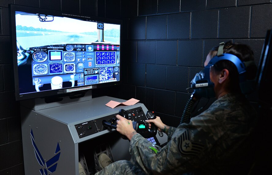 U.S. Air Force Technical Sgt. Carrie Holton, with the 55th Medical Group, flies a simulated aircraft while being attached to environics reduced oxygen breathing device 2 machine inside the 55th Aerospace Medicine Squadron building on Offutt AFB, Neb., Jan. 26. Members of the Air Force’s Biomedical Sciences Corps were recognized during an appreciation week held January 23-27. 