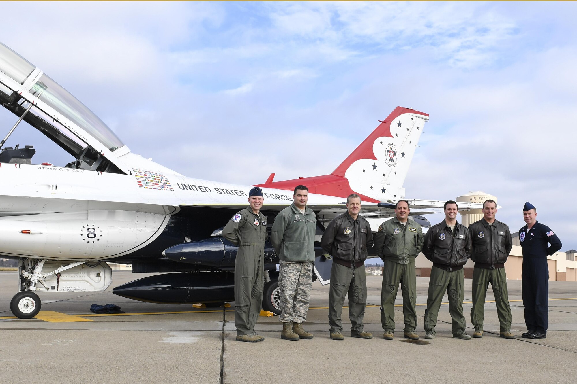 Capt. Erik Gonsalves, advanced pilot and narrator with the U.S. Air Force Thunderbirds, and Staff Sgt. Todd Hughes, tactical aircraft maintainer with the team, pose with members of the Pittsburgh International Airport Air Reserve Station, Pa., Jan. 25, 2017. Gonsalves and Hughes stopped at the Pittsburgh IAP ARS for a site visit in preparation of the upcoming Open House scheduled for May 13-14, 2017. (U.S. Air Force photo by Senior Airman Beth Kobily)