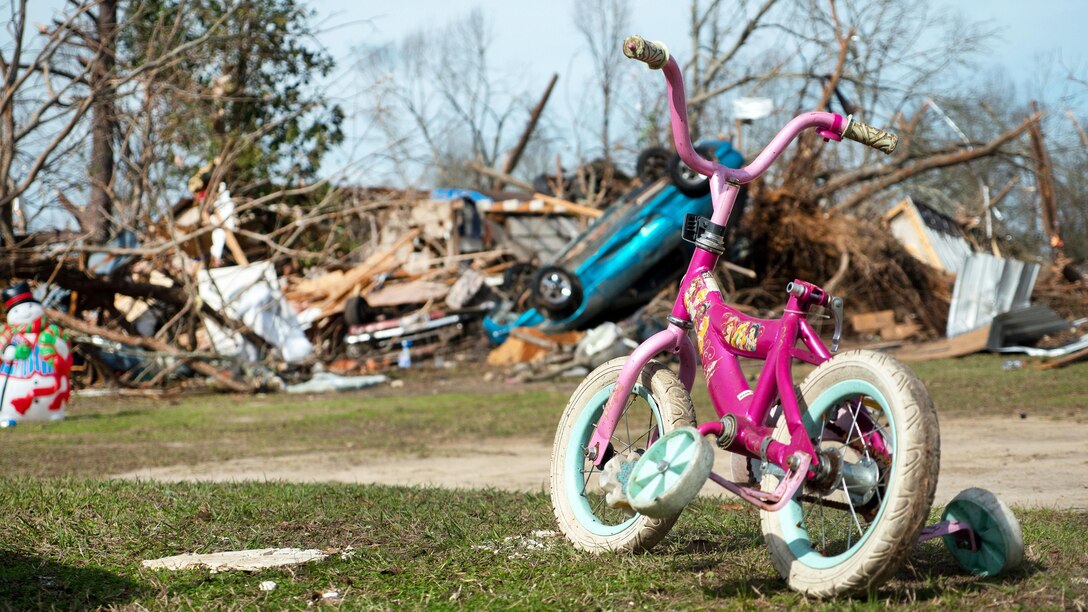 A child’s bike sits near a pile of debris in Hattiesburg, Miss., Jan. 26, 2017, following a tornado. Army National Guard photo by Staff Sgt. Tim Morgan