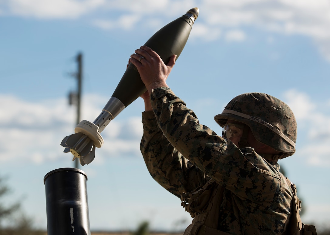 A Marine with Task Force Southwest prepares to load an M121 A1 120mm mortar during a joint mortar shoot aboard Camp Lejeune, N.C., Jan. 24, 2017. The range was conducted to refresh and exchange techniques on firing the M252 81mm and 120mm mortars in preparation for an upcoming deployment to Helmand Province, Afghanistan. The Marines are scheduled to deploy as part of Task Force Southwest to train, advise and assist the Afghan National Army 215th Corps and 505th Zone National Police. (U.S. Marine Corps photo by Sgt. Justin T. Updegraff)