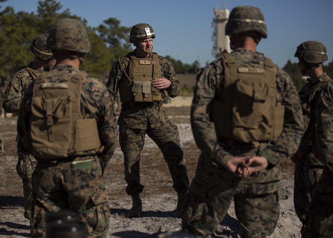 Brig. Gen. Roger Turner, commanding general for Task Force Southwest, talks with Marines during a joint mortar shoot aboard Camp Lejeune, N.C., Jan. 24, 2017. The range was conducted to refresh and exchange techniques on firing the M252 81mm and M121 A1 120mm mortars in preparation for an upcoming deployment to Helmand Province, Afghanistan. The Marines are scheduled to deploy as part of Task Force Southwest to train, advise and assist the Afghan National Army 215th Corps and 505th Zone National Police. (U.S. Marine Corps photo by Sgt. Justin T. Updegraff)