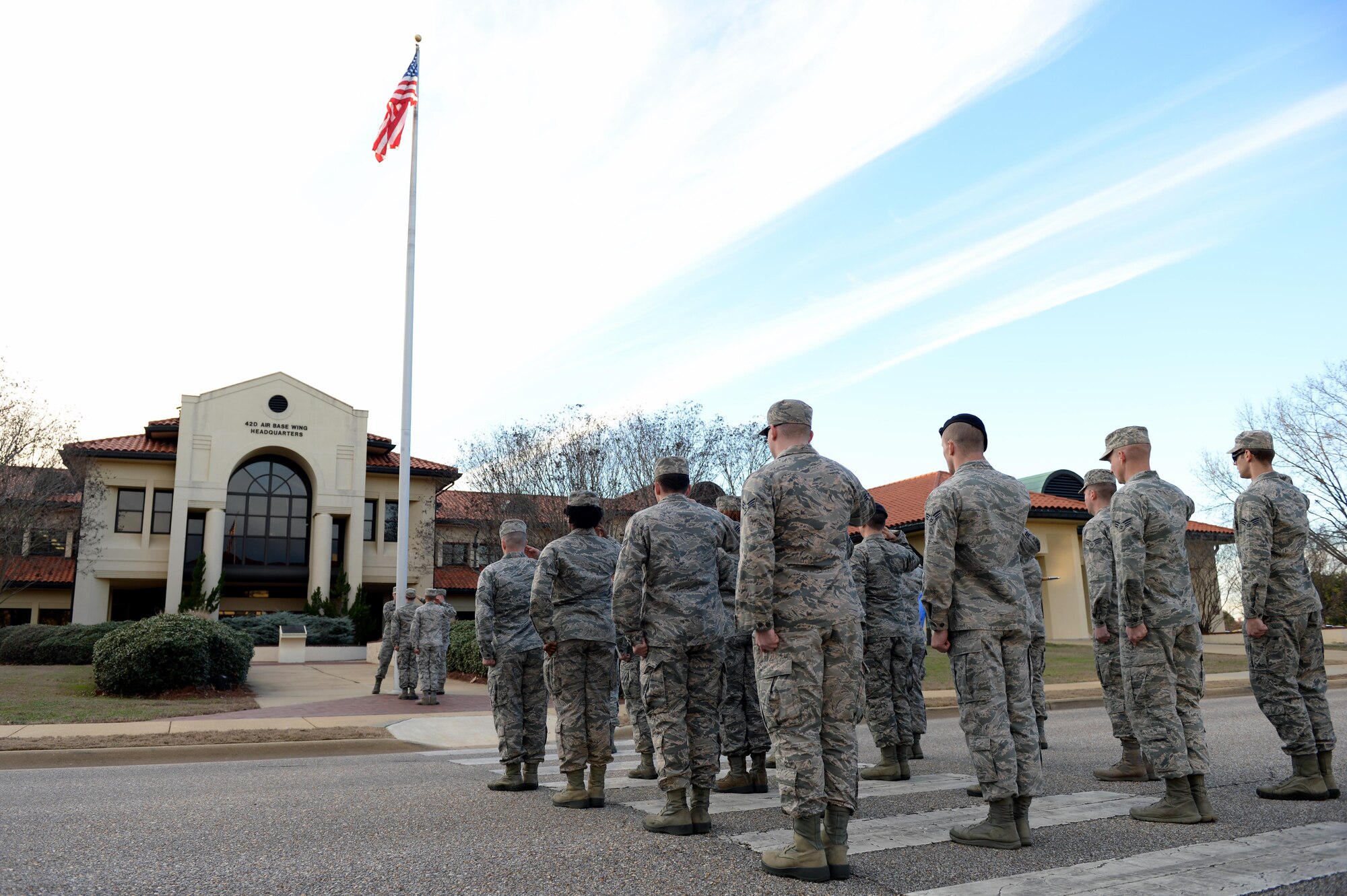 Students from the Airman Leadership School salute the U.S. flag during retreat on Maxwell Air Force Base, Ala., Jan. 26, 2017. All ALS students participate in reveille and retreat every day as part of their duties during the five-week leadership course. (U.S. Air Force photo/Senior Airman Tammie Ramsouer)