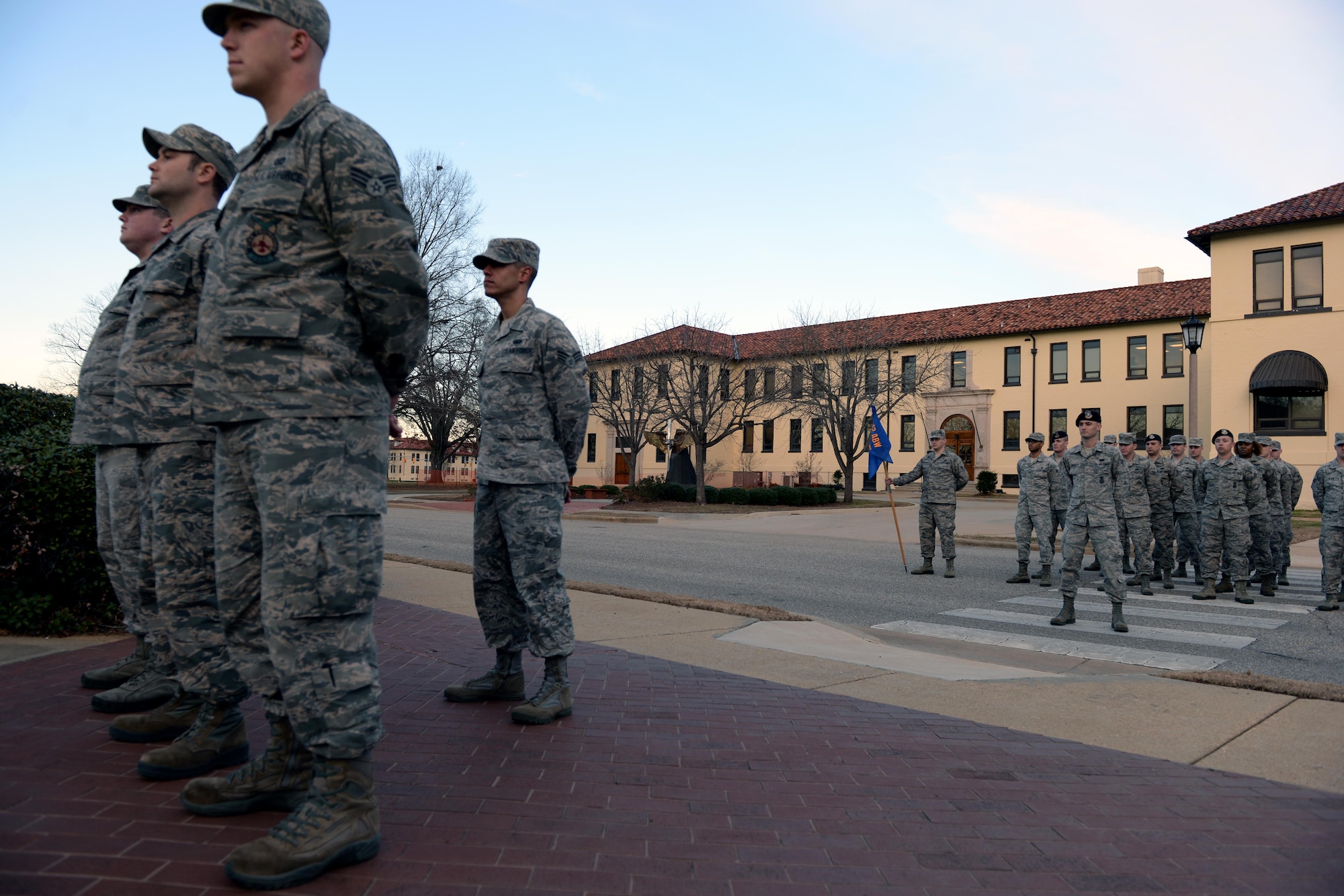 Students from the Airman Leadership School wait for retreat to play on Maxwell Air Force Base, Ala., Jan. 26 2017. All ALS students participate in reveille and retreat every day as part of their duties during the five-week leadership course. (U.S. Air Force photo/Senior Airman Tammie Ramsouer