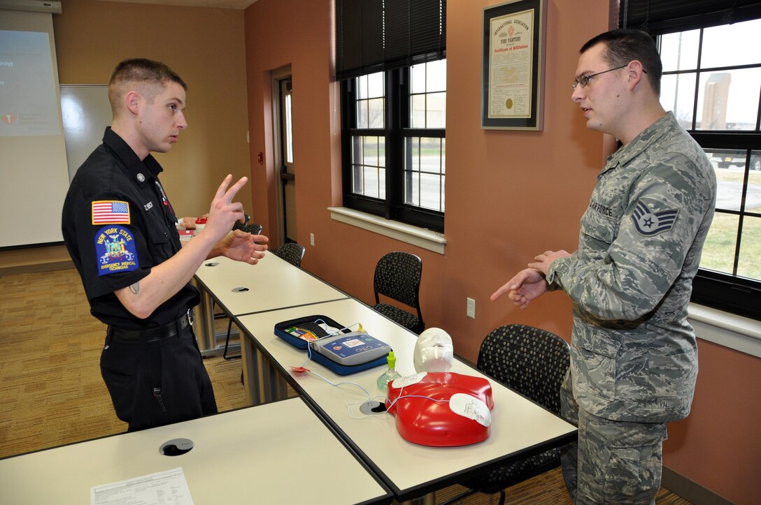 914th Fire Emergency Services Flight firefighter Zachary Weneck instructs Staff Sgt. Keith Partlow, 914th Maintenance Squadron, on the procedure changes to CPR and the Automated External Defibrillator at the Niagara Falls Air Reserve Station, N.Y. January 25, 2017.  Members of the 914th Airlift Wing train continuously to remain current, qualified, and mission ready.  (U.S. Air Force photo by Master Sgt. Kevin Nichols)