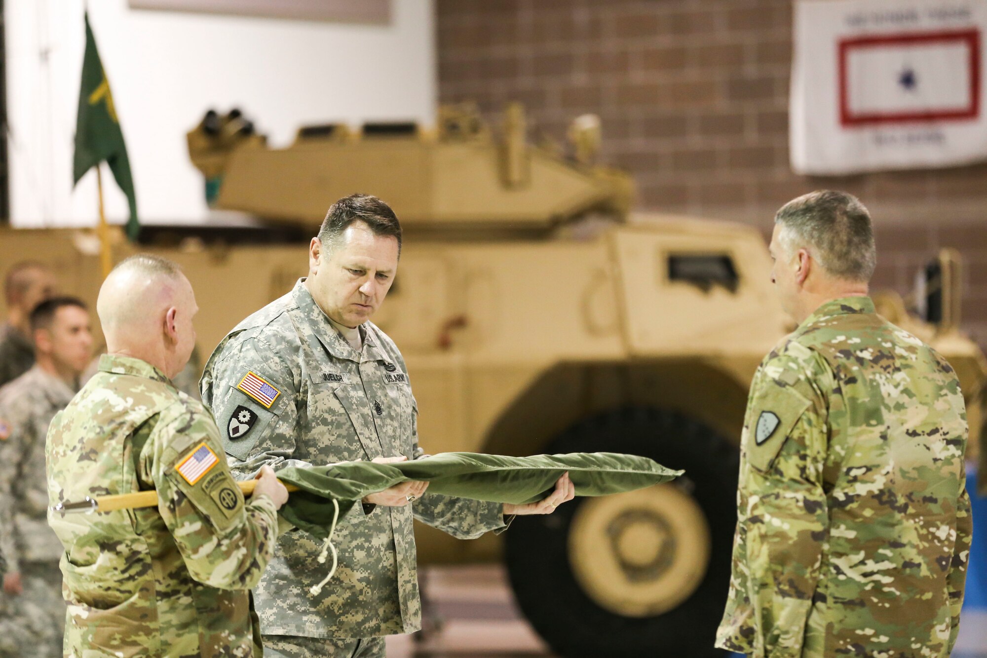 Col. Jeffery Roach, director of strategic plans and policy, Alaska National Guard, presides as Lt. Col. James Palembas, 761st Military Police Battalion commander, holds the unit colors and Command Sgt. Maj. George Juelch, 761st MP BN command sergeant major, cases the colors signifying the unit's deactivation Jan. 22, 2017, at the Alaska National Guard Armory on Joint Base Elmendorf-Richardson. (U.S. Army National Guard photo by Staff Sgt. Balinda O’Neal Dresel)