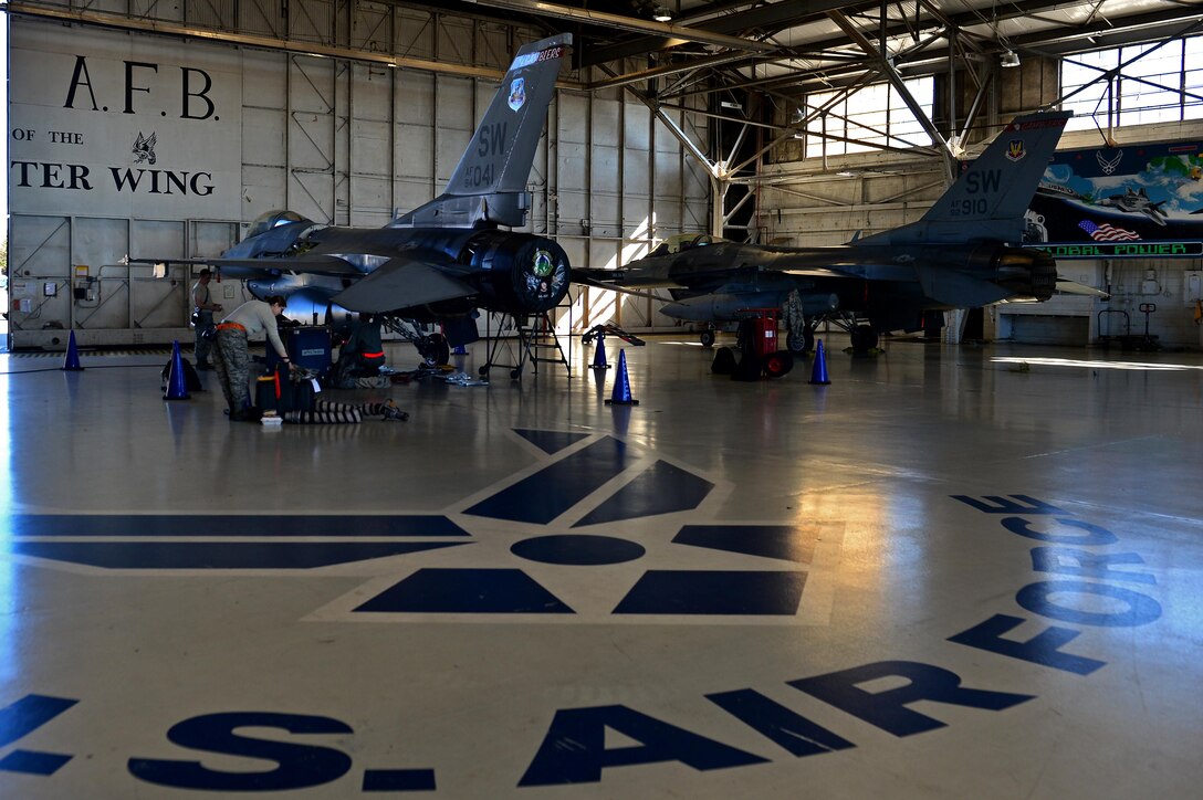 U.S. Airmen assigned to the 20th Aircraft Maintenance Squadron perform repairs on an F-16CM Fighting Falcon at Shaw Air Force Base, S.C., Jan. 25, 2016. The repairs are part of an all-encompassing process, the Repair Network Enhancement Program, which is used by the 20th MXG to ensure that aircraft parts meet all specifications. (U.S. Air Force photo by Airman 1st Class Christopher Maldonado)