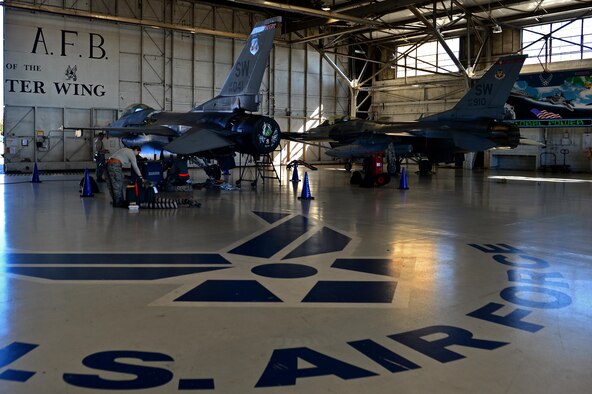 U.S. Airmen assigned to the 20th Aircraft Maintenance Squadron perform repairs on an F-16CM Fighting Falcon at Shaw Air Force Base, S.C., Jan. 25, 2016. The repairs are part of an all-encompassing process, the Repair Network Enhancement Program, which is used by the 20th MXG to ensure that aircraft parts meet all specifications. (U.S. Air Force photo by Airman 1st Class Christopher Maldonado)