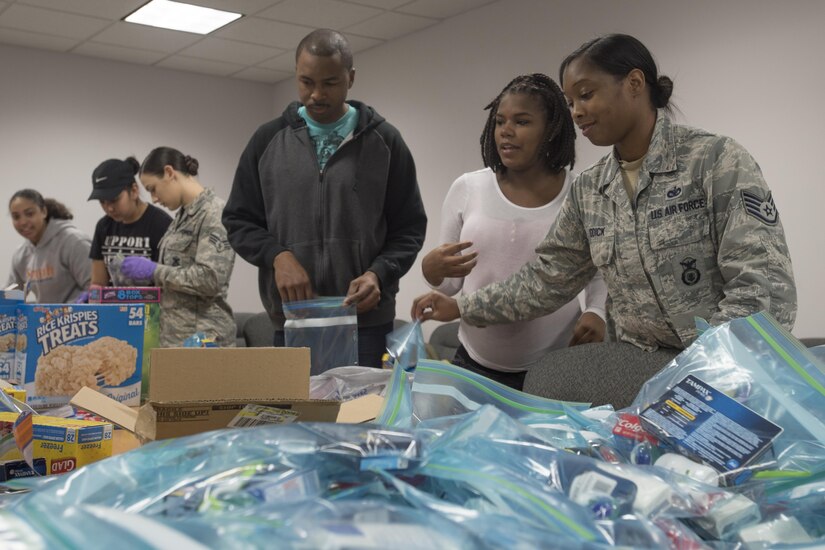 Joint Base Andrews members prepare hygiene kits at JBA, Md., for a community drive in recognition of Martin Luther King Jr. Day, Jan. 25, 2016. Volunteers handed out bagged lunches and hygiene kits to community members in need at the Community for Creative Non-Violence in Washington, D.C.