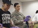 Senior Airm Bernadette Galindo, left, 11th Security Forces Squadron elite gate guard, and Senior Airman Emily Pearce, right, 11th Security Support Squadron unit scheduler, prepare sandwiches at Joint Base Andrews, Md., for a community drive in recognition of Martin Luther King Jr. Day, Jan. 25, 2017. Volunteers prepared approximately 300 bagged lunches to hand out to community members in need at the Community for Creative Non-Violence in Washington, D.C.