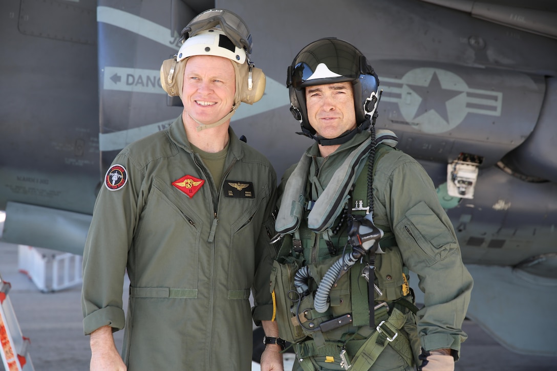 Maj. Gen. John Love, 2nd Marine Division commanding general, stands beside Col. John Rahe, assistant wing commander, in front of an AV-8B Harrier aboard Marine Corps Air Station Cherry Point, Jan. 27, 2017. Love’s visit helped strengthen the relationship between the ground and air combat element while witnessing the aircraft’s capabilities firsthand. Rahe is the assistant wing commander for 2nd MAW. (U.S. Marine Corps photo by Lance Cpl. Cody Lemons/Released)