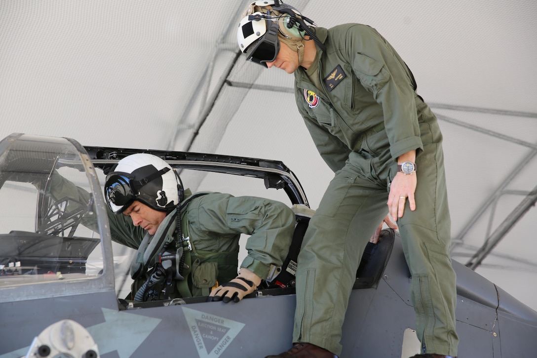 Maj. Gen. John Love, 2nd Marine Division commanding general, climbs into an AV-8B Harrier assigned to Marine Attack Training Squadron 203, Marine Aircraft Group 14, 2nd Marine Aircraft Wing aboard Marine Corps Air Station Cherry Point, Jan. 27, 2017. This was Love’s first time getting to see the capabilities of the aircraft firsthand. His visit helped strengthen the relationship between the ground and air combat elements of the Marine Air-Ground Task Force. (U.S. Marine Corps photo by Lance Cpl. Cody Lemons/Released)