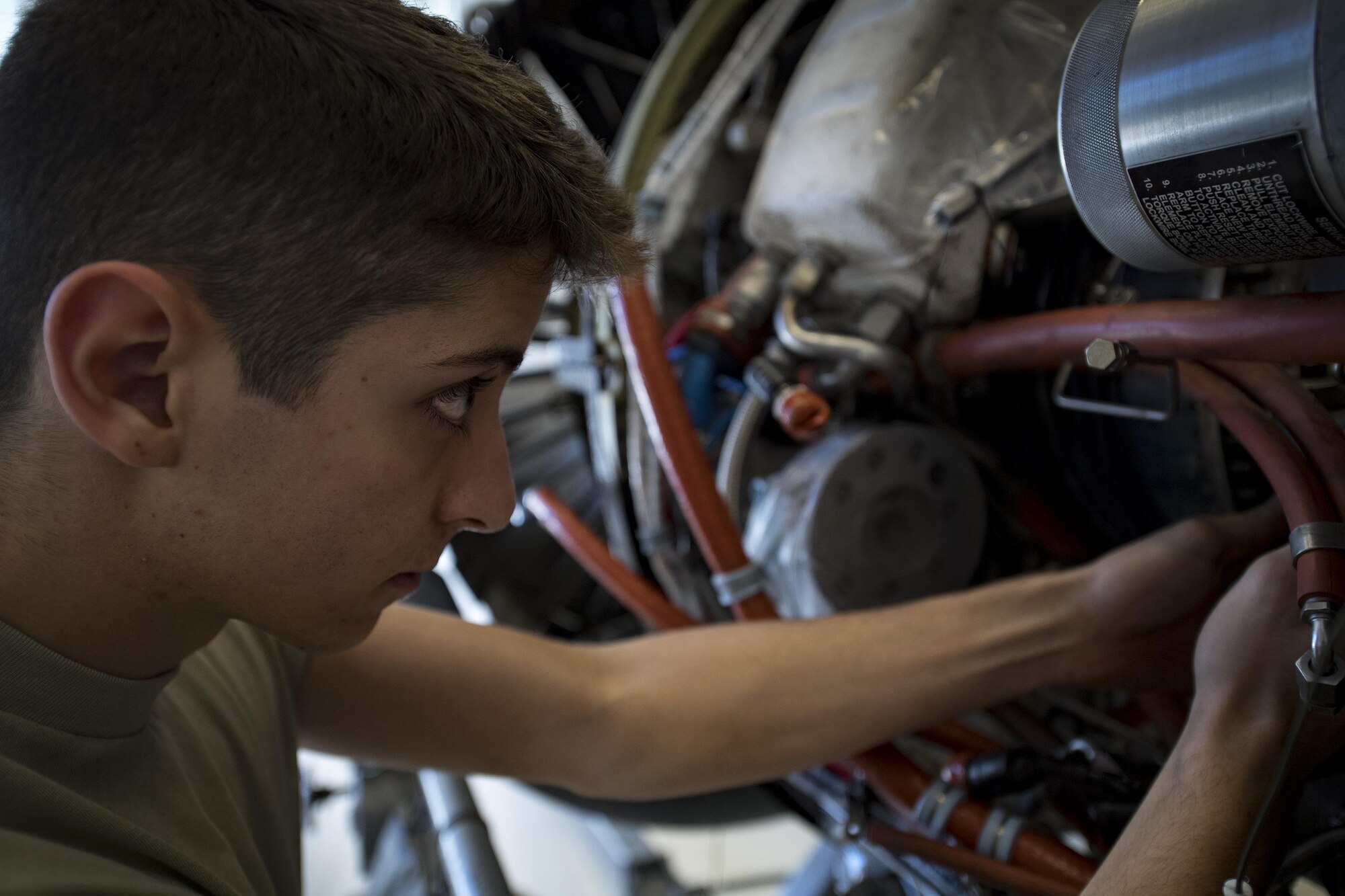 Airman Robert Pauley-Coiner, 23d Component Maintenance Squadron propulsion technician, reaches into a TF-34 engine used in A-10C Thunderbolt lls, Jan. 25, 2017, at Moody Air Force Base, Ga. Approximately 20 Airmen of all ranks participated in a Continuous Process Improvement event where they brainstorm better ways to conduct maintenance. (U.S. Air Force photo by Airman 1st Class Daniel Snider)