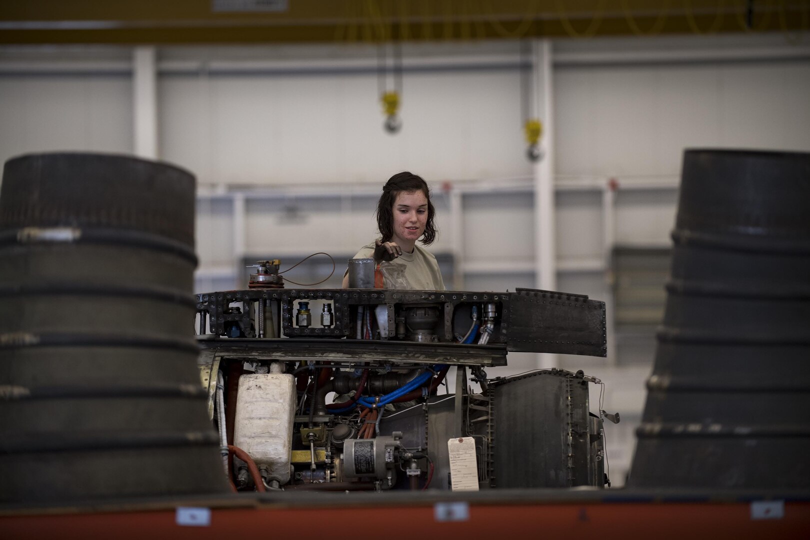 Airman 1st Class Teresa Springer, 23d Component Maintenance Squadron propulsion technician, drops nuts and bolts into a plastic baggie while dissembling a TF-34 engine used in A-10C Thunderbolt lls, Jan. 25, 2017, at Moody Air Force Base, Ga. Airmen from the propulsion flight are responsible for breaking down, refurbishing and repairing TF-34 engines to replace ones currently in use in A-10s. (U.S. Air Force photo by Airman 1st Class Daniel Snider)