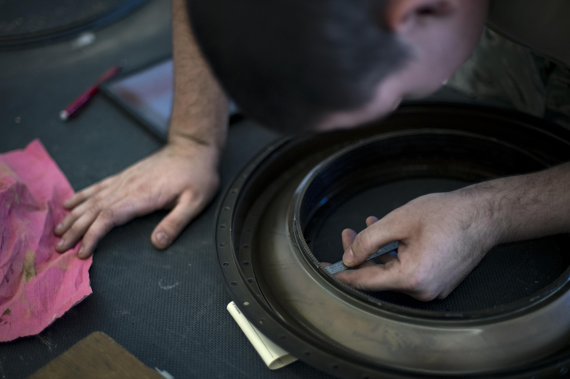 Airman 1st Class Jesse Mendheim, 23d Component Maintenance Squadron propulsion technician, measures the wear on a component from within a TF-34 engine used in A-10C Thunderbolt lls, Jan. 25, 2017, at Moody Air Force Base, Ga. The 23 CMS is currently involved in a Continuous Process Improvement event attempting to decrease the time it takes to overhaul the TF-34 engine by two days. (U.S. Air Force photo by Airman 1st Class Daniel Snider)